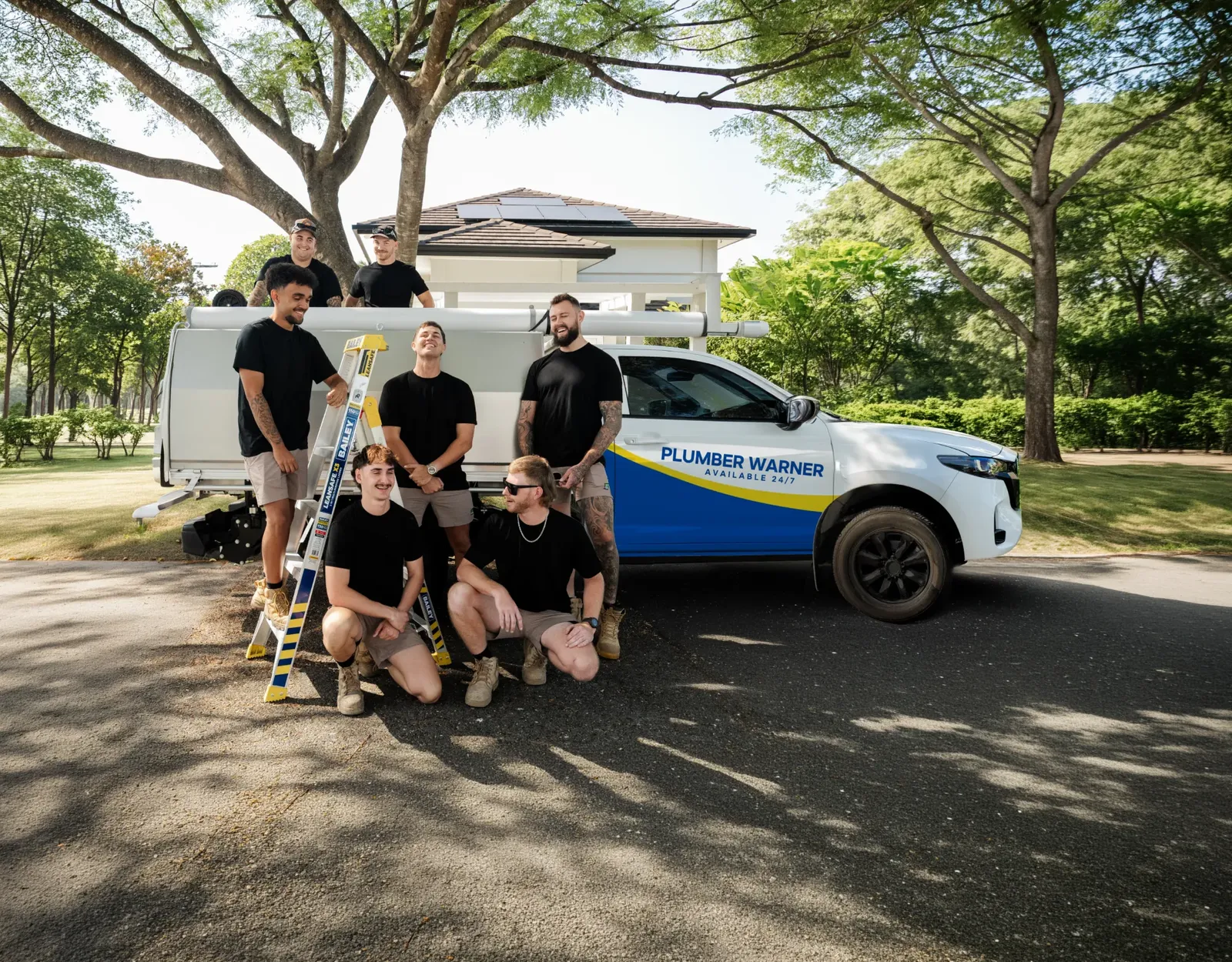 Plumber Warner ute and team