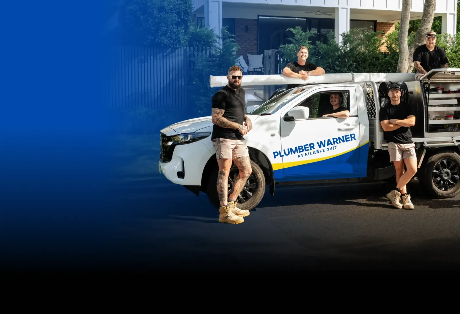 Plumber Warner team with the ute